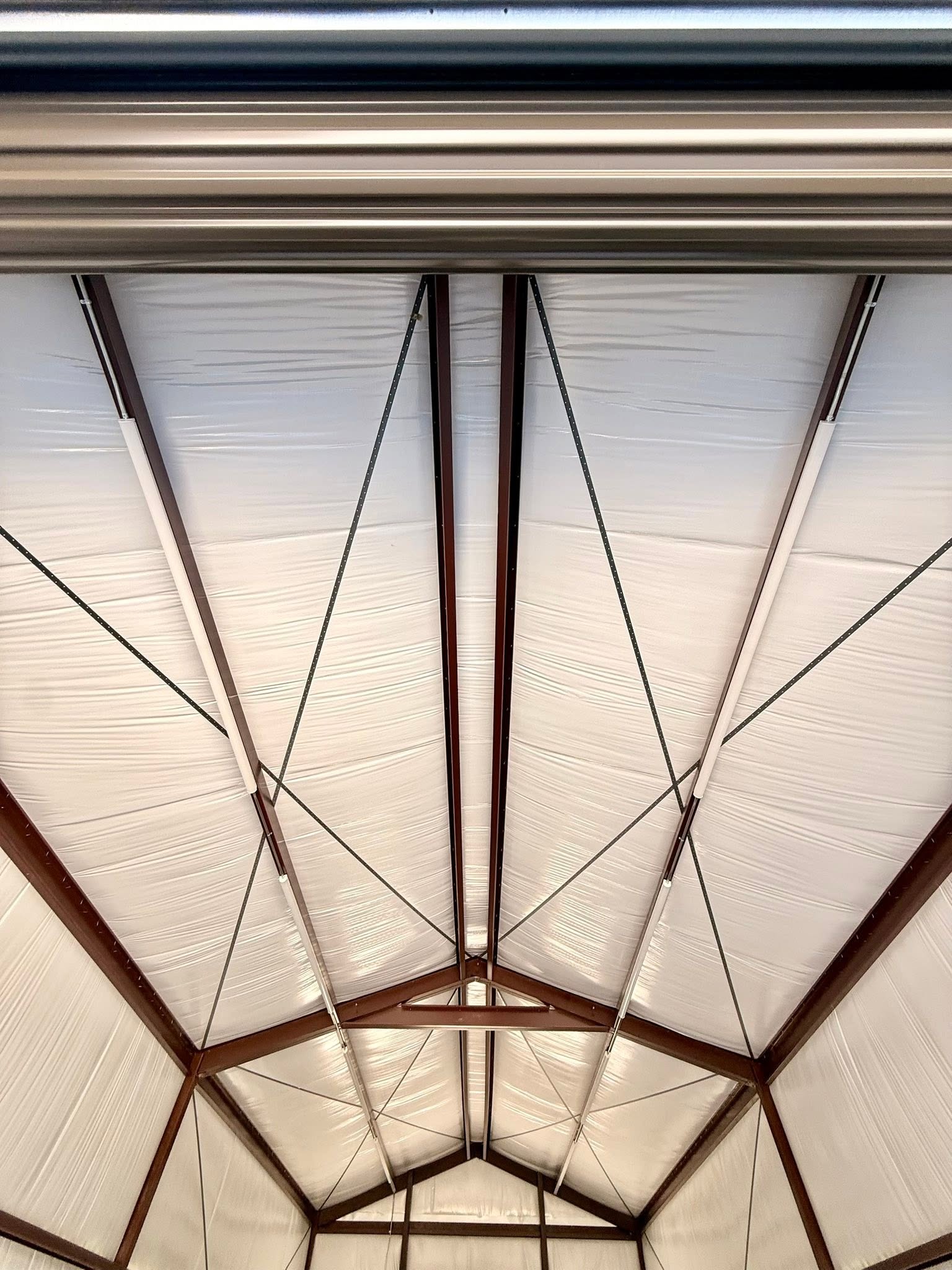 Insulated steel roof system inside a custom metal building by B&J Metal Buildings LLC, highlighting energy-efficient construction and structural framing in Louisiana.